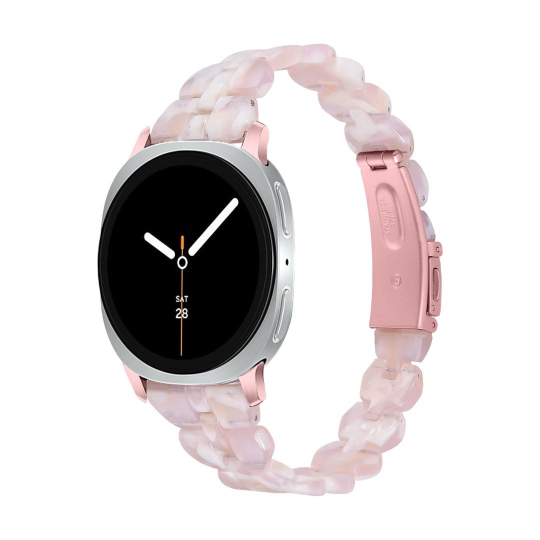 Bracelet Samsung Watch en résine rose pâle, maille épaisse chic, boucle déployante rose métallique.