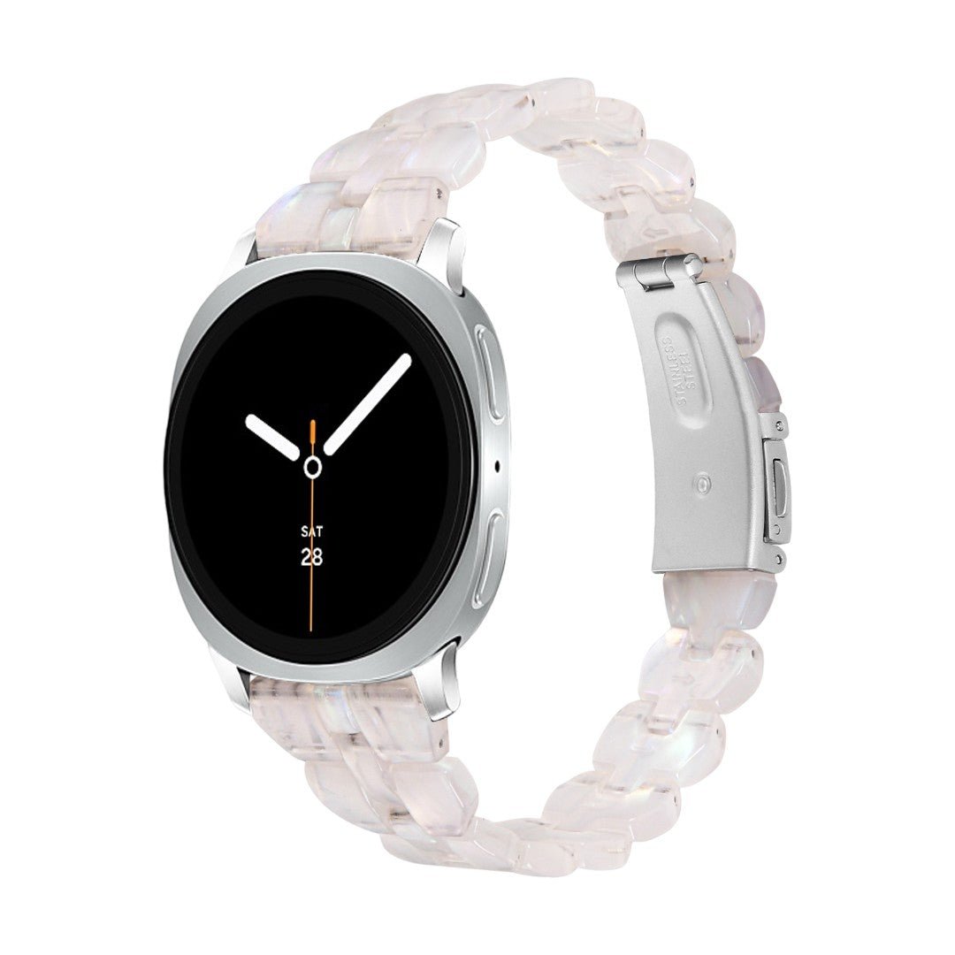 Bracelet Samsung Watch en résine rose translucide à maillons épais avec boucle déployante en acier argenté.