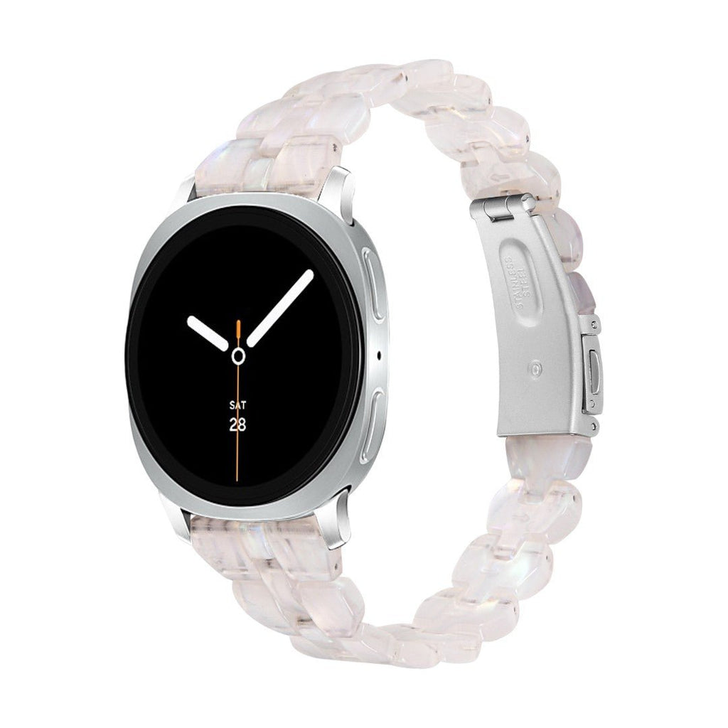 Bracelet Samsung Watch en résine rose translucide à maillons épais avec boucle déployante en acier argenté.