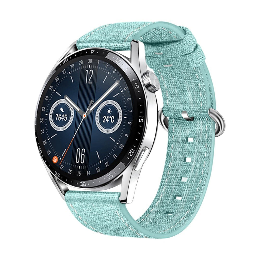 Bracelet montre en tissu nylon bleu clair, boucle ardillon argentée, style sportif et léger, confortable et résistant à.