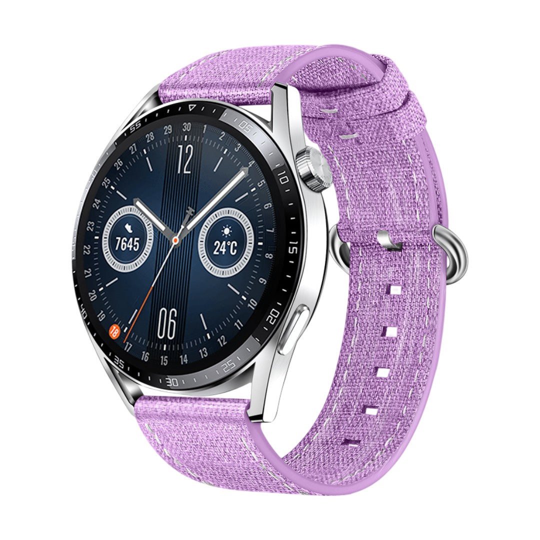 Bracelet montre en tissu nylon violet avec boucle ardillon argentée, léger et confortable.