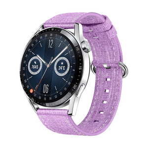 Bracelet montre en tissu nylon violet avec boucle ardillon argentée, léger et confortable.