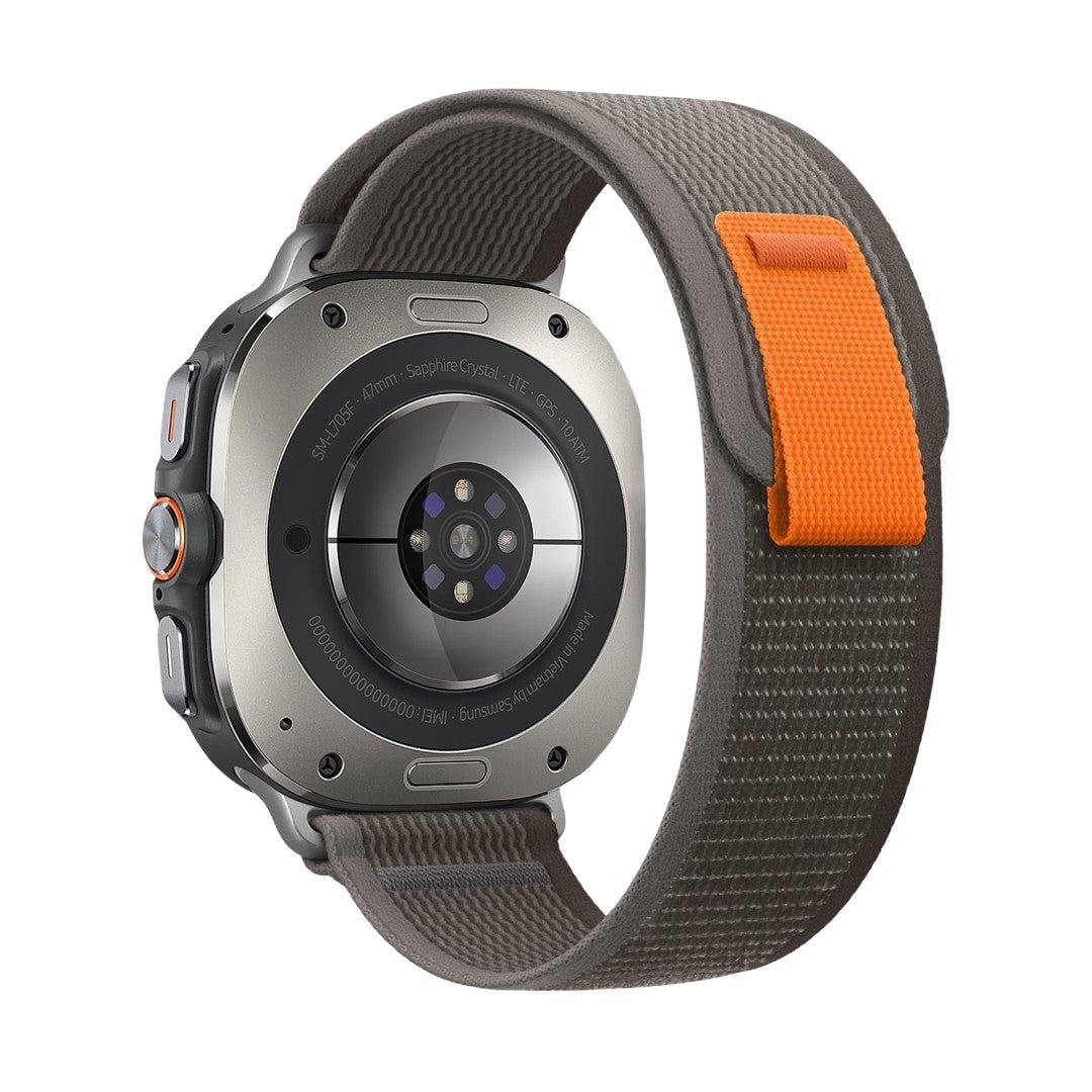Bracelet Samsung Watch Ultra en nylon tressé gris avec boucle velcro orange robuste et ajustable.