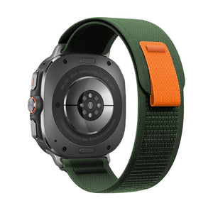 Bracelet tactique Samsung Watch Ultra vert nylon tressé avec boucle velcro orange robuste.