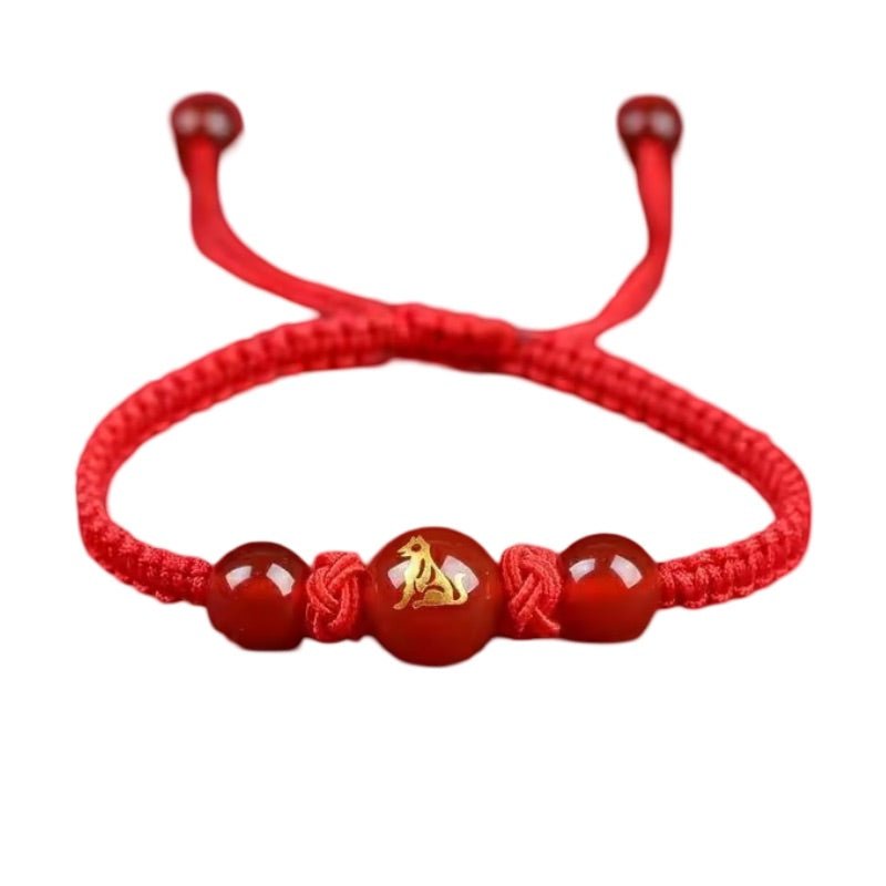 Bracelet rouge en nylon avec perles rouges et symbole doré du signe du Zodiaque Chinois Tigre.