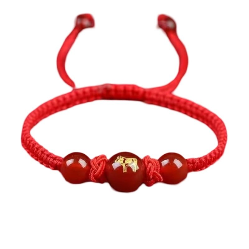 Bracelet en nylon fil rouge avec perles rouges et pendentif doré signe zodiaque chinois Tigre.