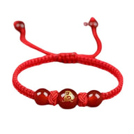 Bracelet en nylon rouge avec perles rouges et médaille en métal gravée du signe du zodiaque chinois Lapin.