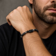 Bracelet élastique en pierres noires naturelles, perles de lave mat et hématite brillante, style zodiacal masculin.