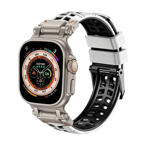 Bracelet Apple Watch en silicone blanc et noir perforé, fermoir ardillon solide, sportif et ventilé.
