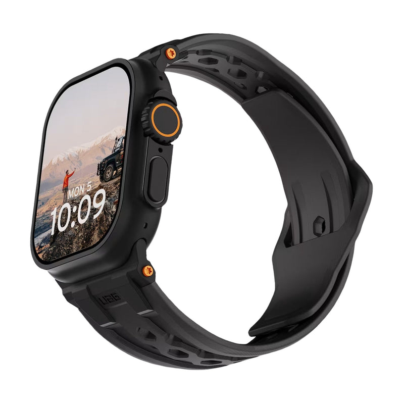Bracelet silicone noir robuste avec détails orange pour Apple Watch, design perforé et fermoir métal.
