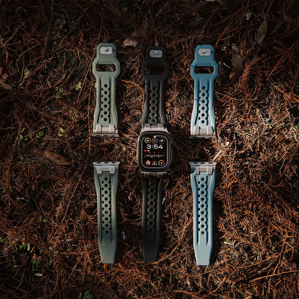 Bracelet silicone perforé résistant à l’eau pour Apple Watch avec fermoir métal, couleurs beige, noir et bleu, design.