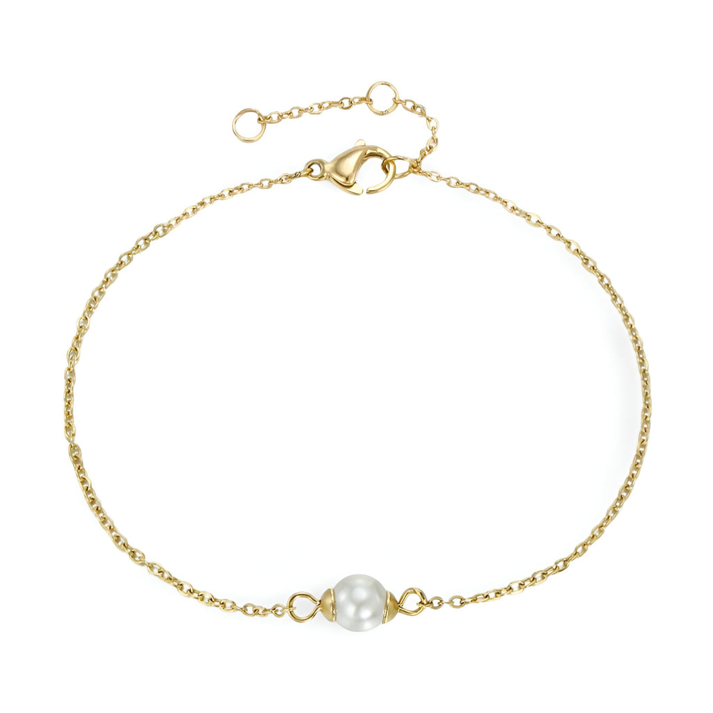 Bracelet fin en acier inoxydable doré avec perle centrale blanche et fermoir mousqueton.