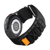 Bracelet nylon noir sport avec fermeture velcro et détail orange pour Samsung Galaxy Watch.