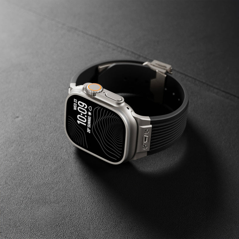 Bracelet noir en silicone résistant avec fermoir papillon argent pour Apple Watch.