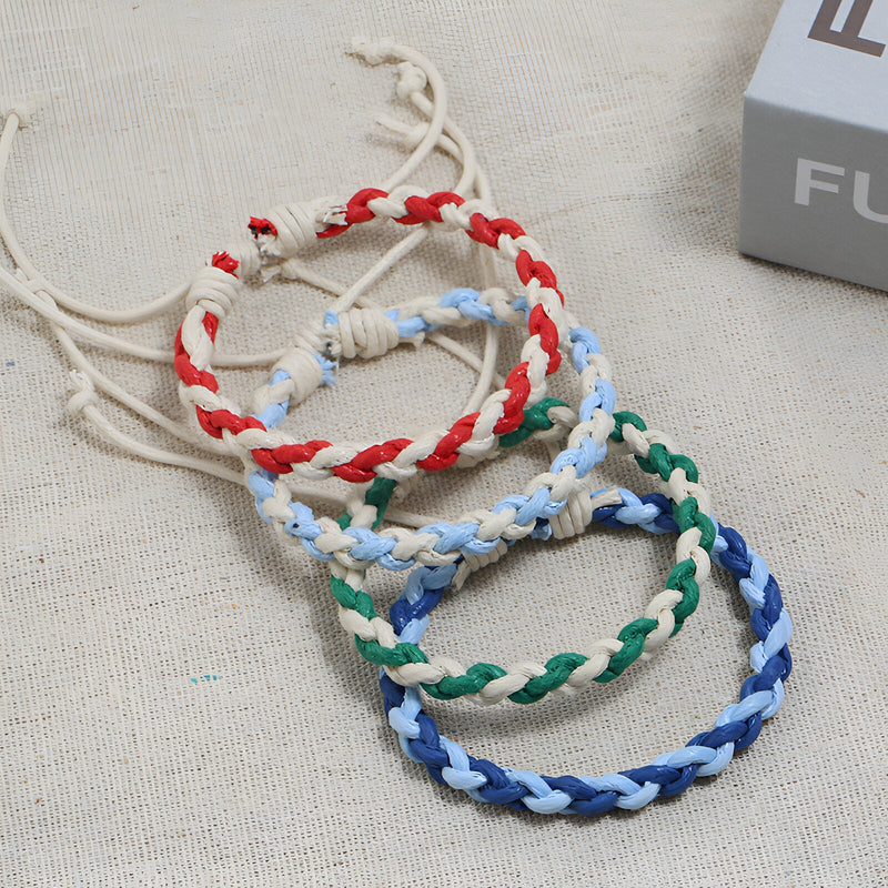 Lot de bracelets tissés bi-colores rouge, vert, bleu et bleu clair, style mixte avec cordon ajustable.