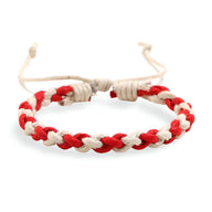 Bracelet tissé bi-colore rouge et beige avec fermeture ajustable en coton.
