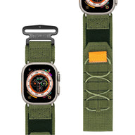 Bracelet Apple Watch Trail Edition en nylon vert militaire avec fermeture velcro et nœuds tactiques orange.