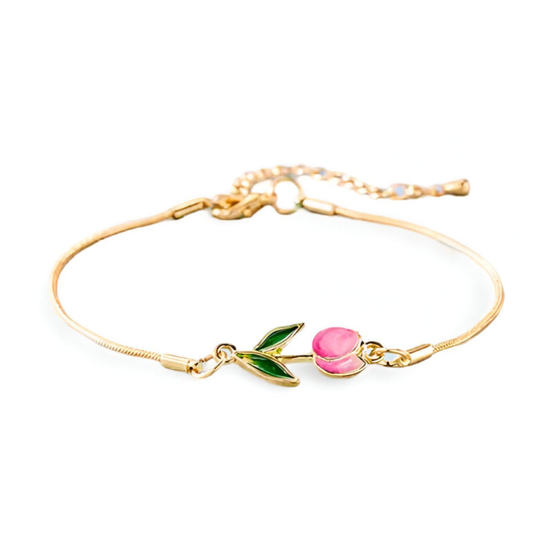 Bracelet en cuivre doré avec petit pendentif tulipe rose et feuilles vertes, design délicat pour femme.