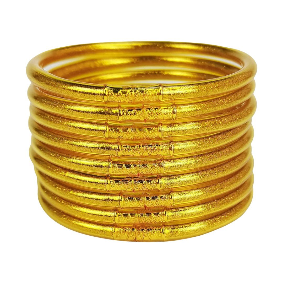 Lot de neuf bracelets joncs en silicone souple dorés avec finition brillante, empilables, design minimaliste et chic.