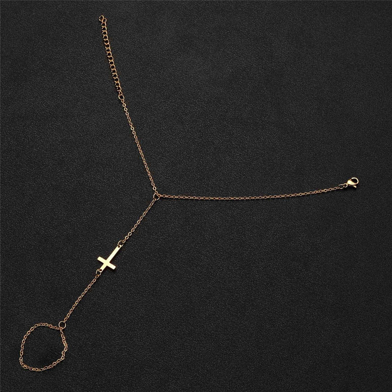 Bracelet de main chaîne fine en acier inoxydable doré avec croix chrétienne moderne.