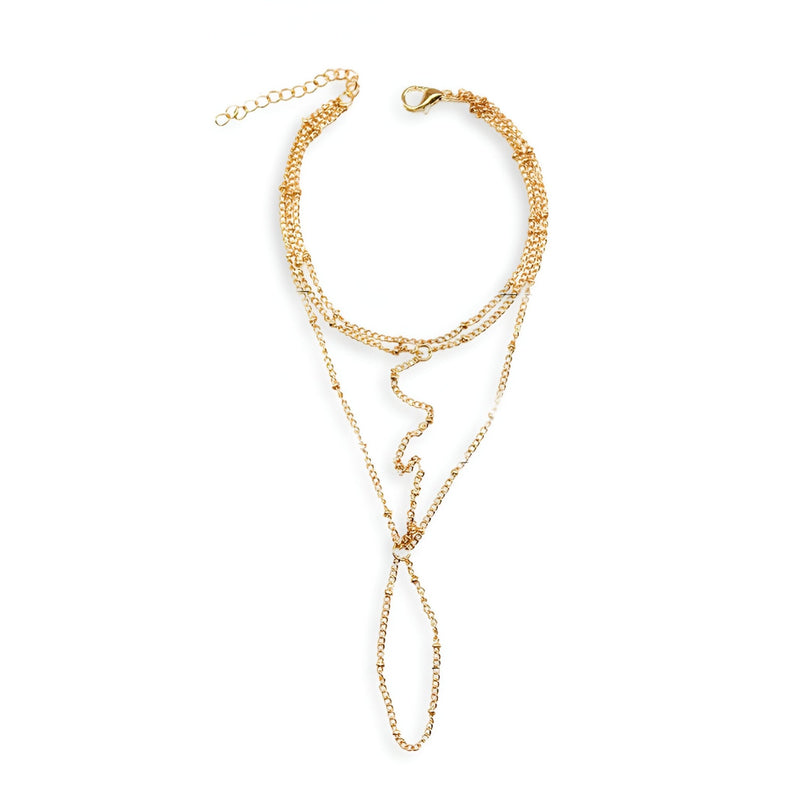 Bijou de main multi-rangs en acier inoxydable doré avec chaînes fines et anneau connecté pour doigt.