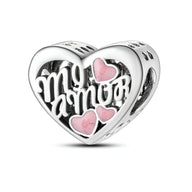 Charm cœur en argent avec inscription "Mi Amor" et trois petits cœurs roses intégrés.