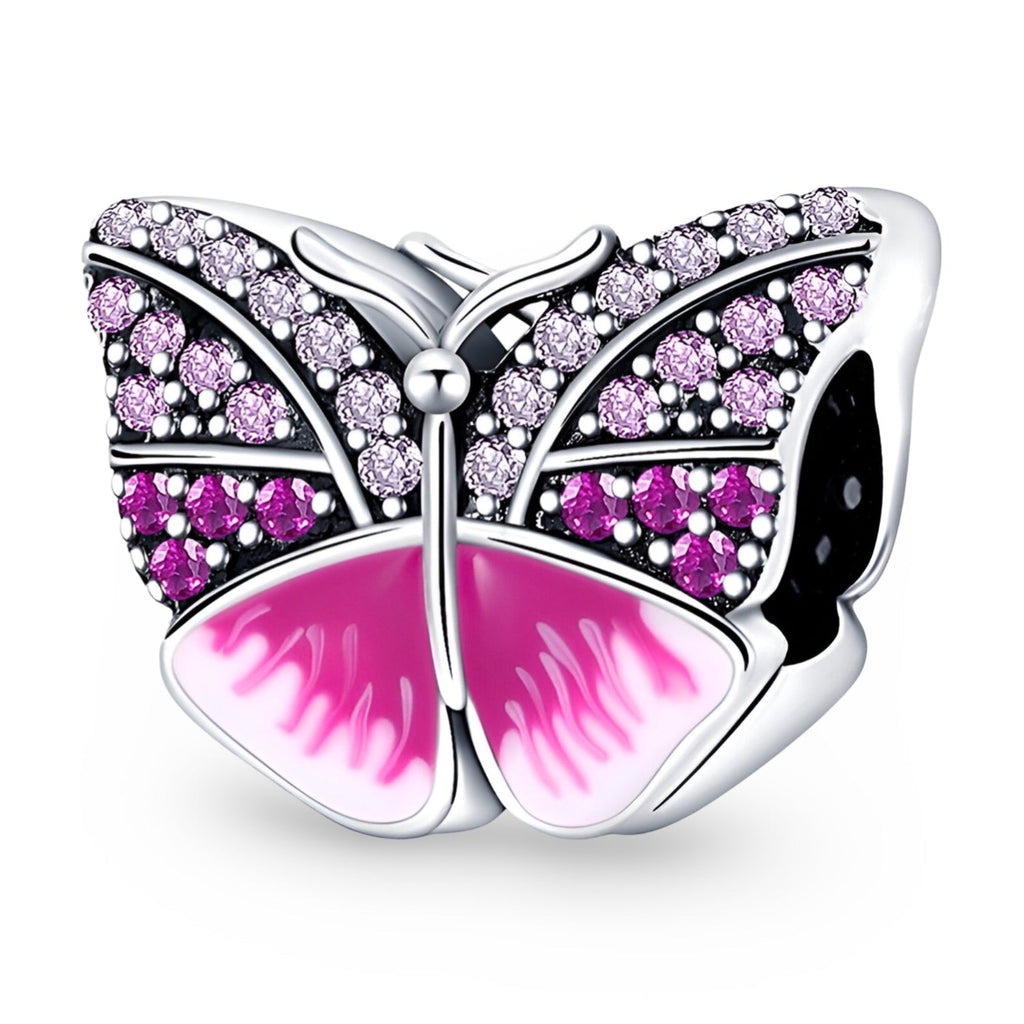 Charm papillon argent avec pierres roses et dégradé rose émaillé sur les ailes.