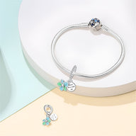 Bracelet en argent avec charm fleur turquoise et pendentif rond gravé "Grow love with me".