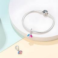 Bracelet en argent avec pendentif luciole scintillante rose et bleu, modèle Delfina.