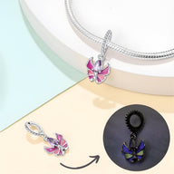 Charm pendentif papillon en argent avec ailes roses et détails lumineux, modèle Agnetha.
