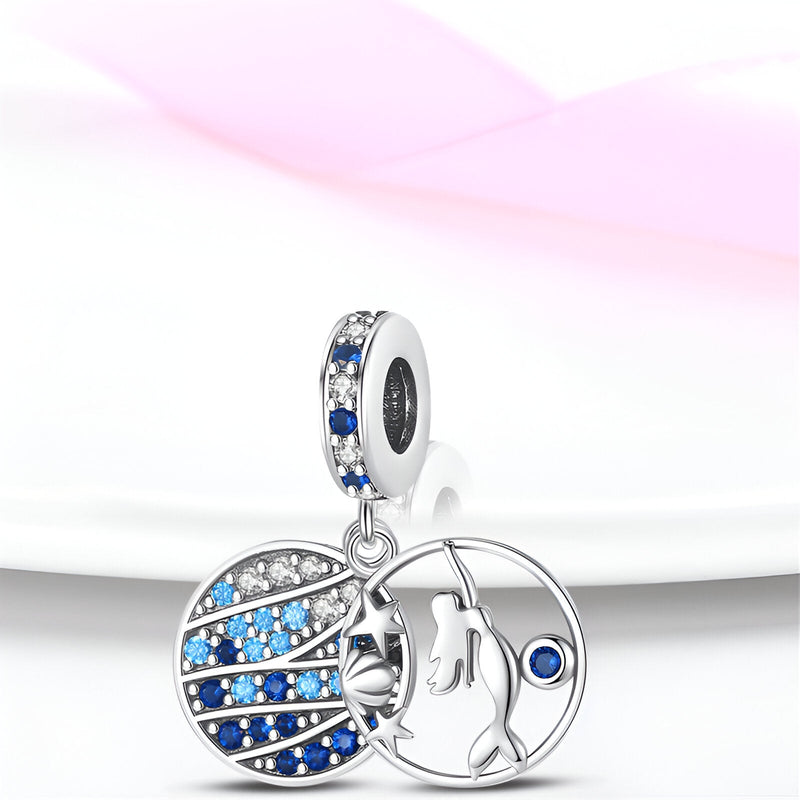 Charm pendentif sirène argent avec pierres bleues et blanches serties, détail étoile de mer.