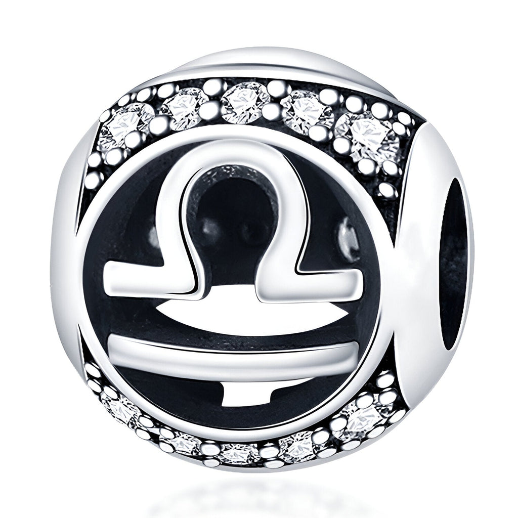 Charm rond en argent avec symbole zodiaque Balance noir et strass scintillants.