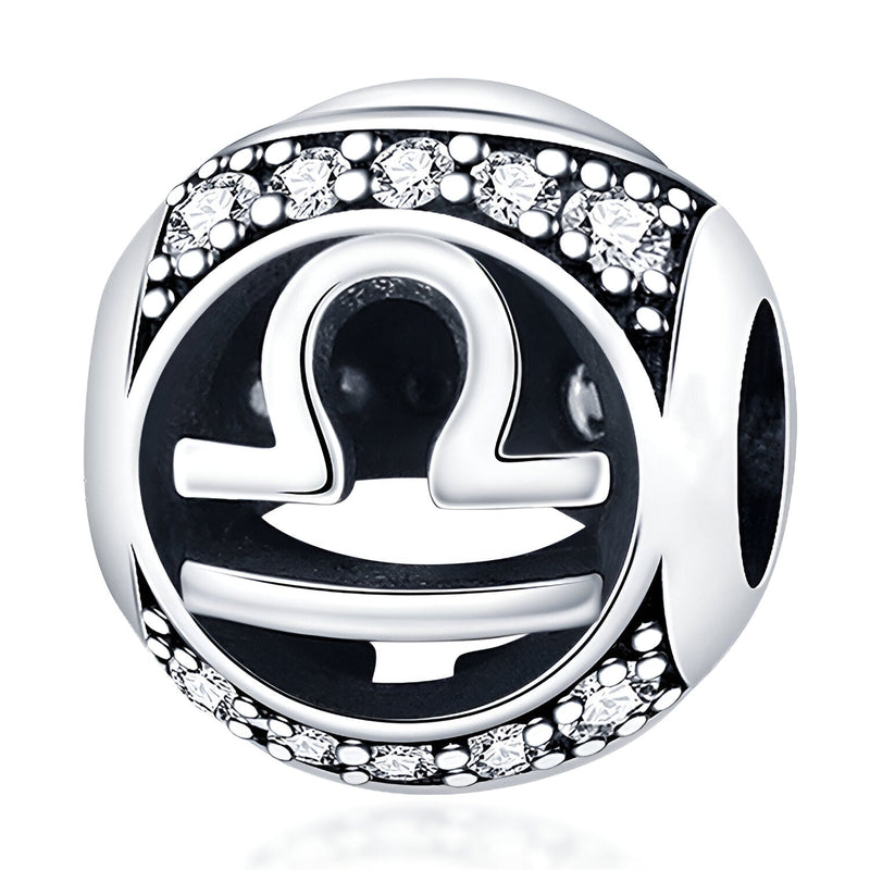 Charm rond en argent avec symbole zodiaque Balance noir et strass scintillants.