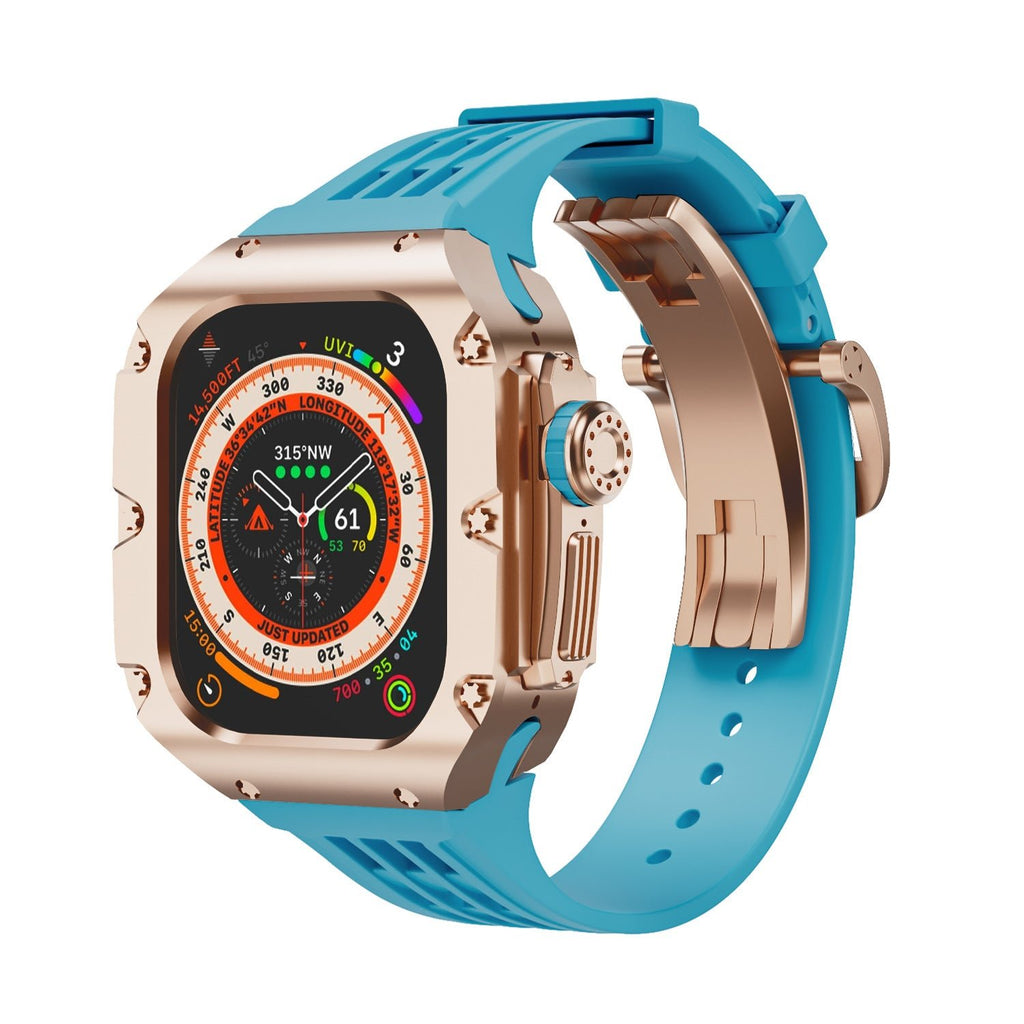 Coque en titane couleur or rose avec bracelet silicone bleu à boucle pour Apple Watch Ultra 49mm, style robuste et sportif.