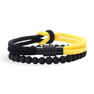 Duo de bracelets homme noir et jaune, cordon tressé avec nœud central et perles d’onyx mat.