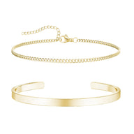 Duo de bracelets homme en acier inoxydable, jonc lisse doré et chaîne fine dorée réglable.