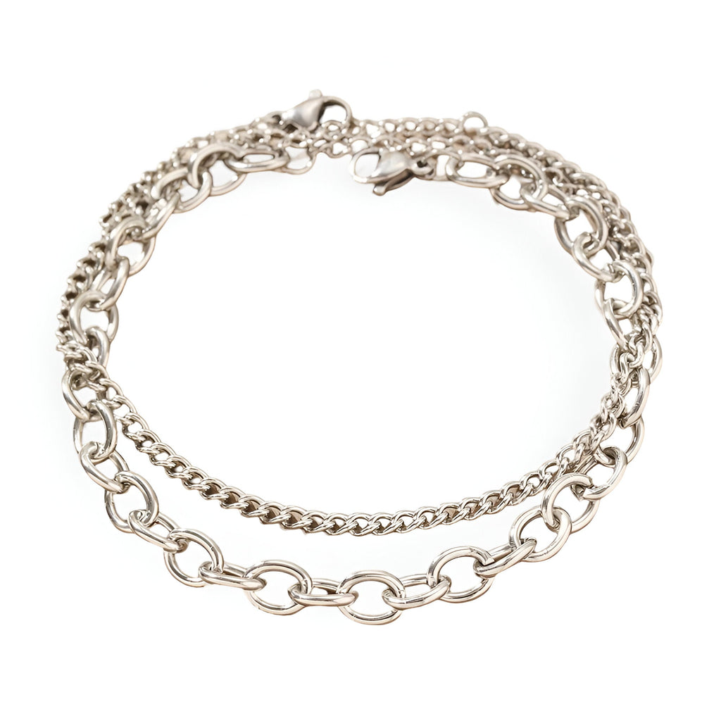 Duo de bracelets en acier inoxydable argenté, chaînes fines et maillons ovales, fermoirs lobster clasp.