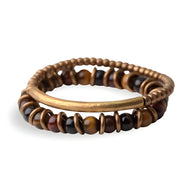 Duo de bracelets femme en perles d’œil de tigre marron et bande de cuivre lisse, style naturel et moderne.