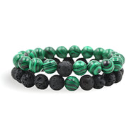 Duo de bracelets mixtes en pierres naturelles malachite verte et perles volcaniques noires texturées.