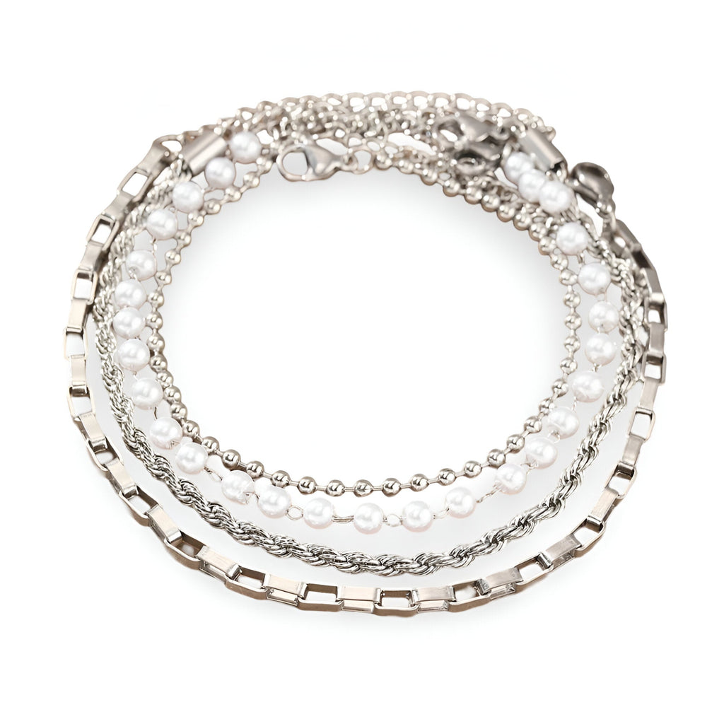 Ensemble de 4 bracelets en acier inoxydable argenté, styles chaîne variés et perles fines.