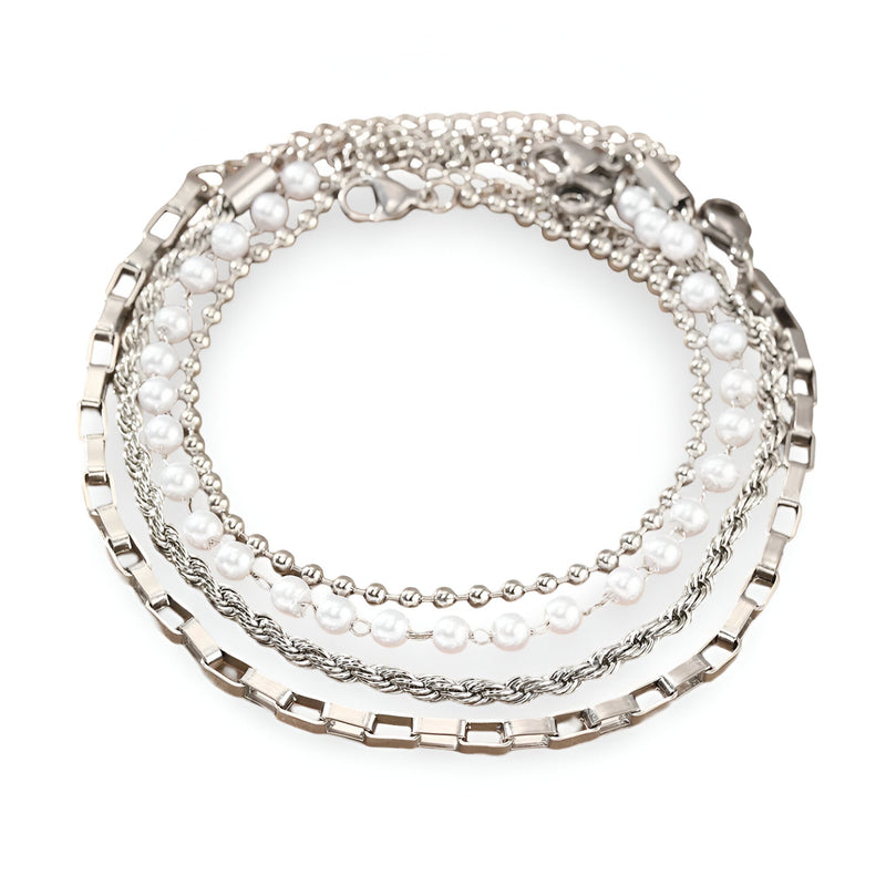 Ensemble de 4 bracelets en acier inoxydable argenté, styles chaîne variés et perles fines.