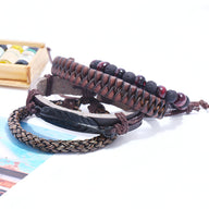 Ensemble de 4 bracelets noirs homme en microfibre tressée et pierres volcaniques, style robuste.