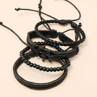 Ensemble de 4 bracelets noirs en cuir et cordon avec motif gouvernail et perles pour homme.