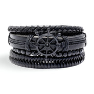 Ensemble de 4 bracelets noirs en cuir tressé et lisse avec motif gouvernail métallique central.