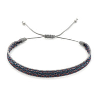 Bracelet tibétain gris à motif zigzag rouge et bleu avec cordon coulissant pour homme.