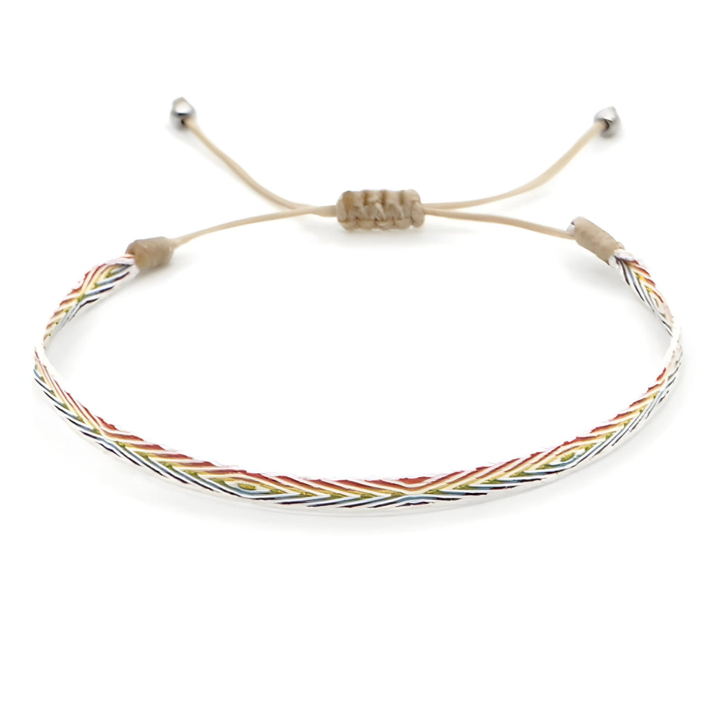 Trio de bracelets tibétains tressés marron, argent et oeil de tigre avec fermeture coulissante.