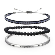 Trio de bracelets pour homme avec perles volcaniques noires, bracelet tissé bleu et noir, jonc argenté gravé.