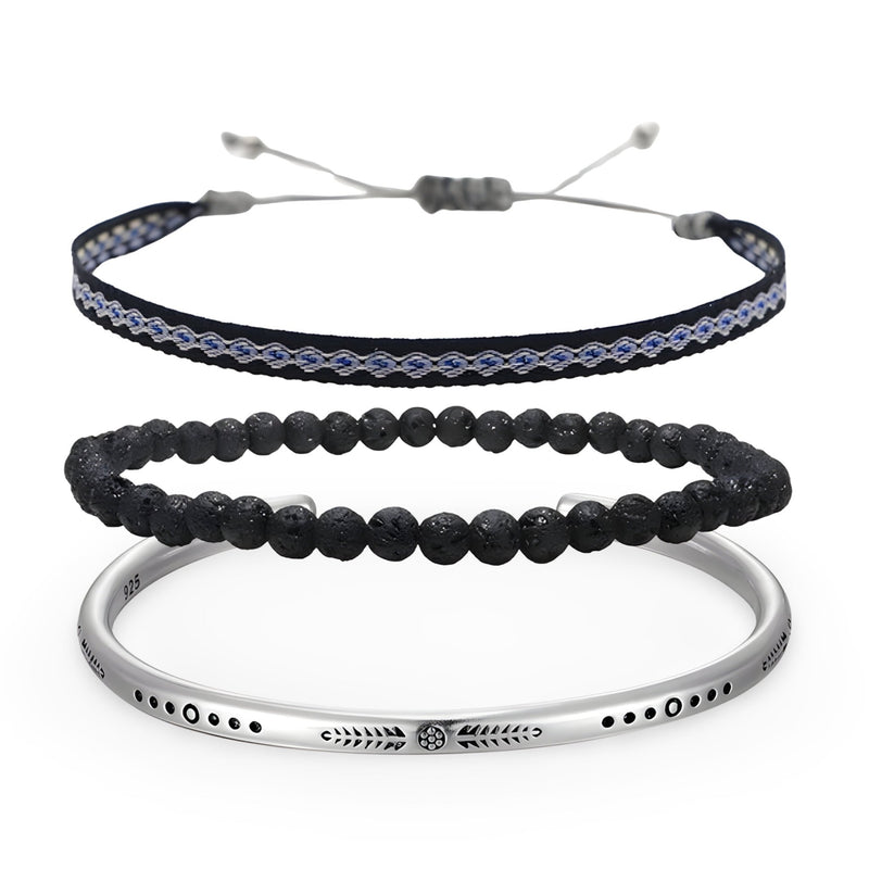 Trio de bracelets pour homme avec perles volcaniques noires, bracelet tissé bleu et noir, jonc argenté gravé.