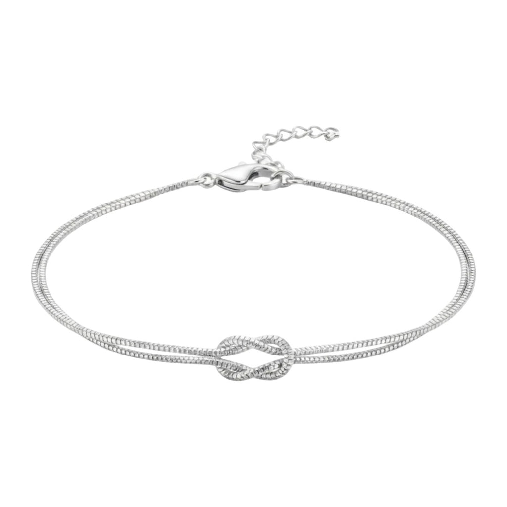 Bracelet fin en acier inoxydable argenté avec nœud central élégant, chaîne double délicate ajustable.