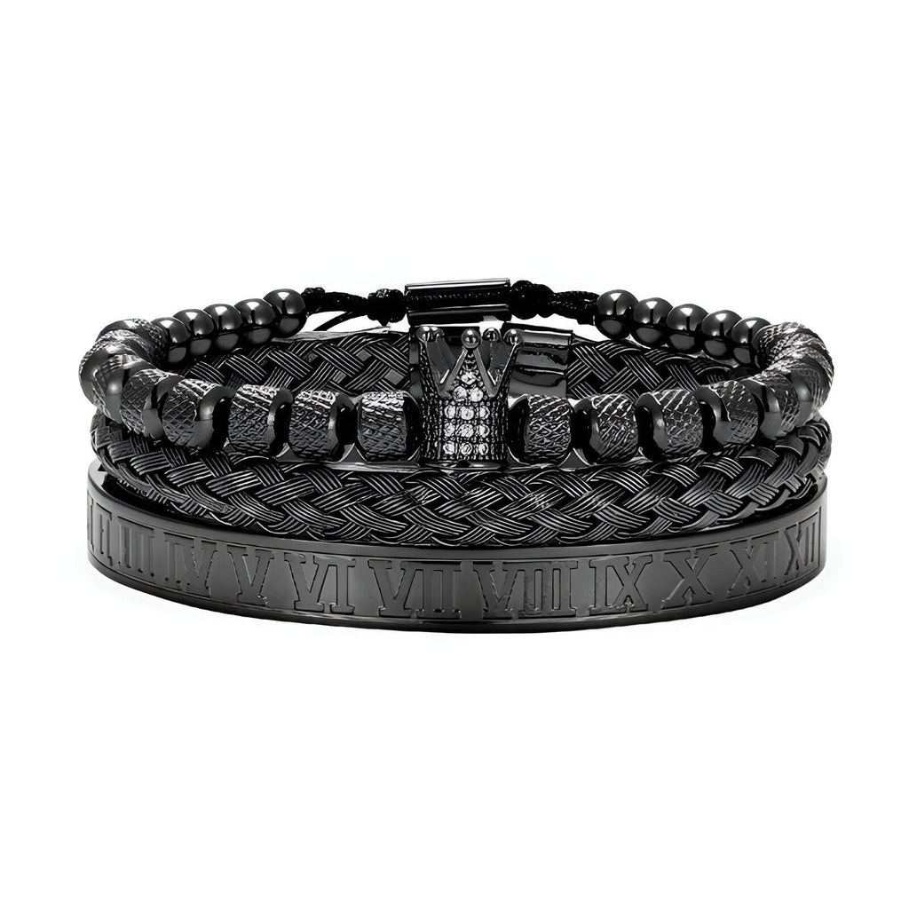 Trio de bracelets homme noirs en acier inoxydable, un tressé, un à billes, un avec détails chiffres romains et couronne.